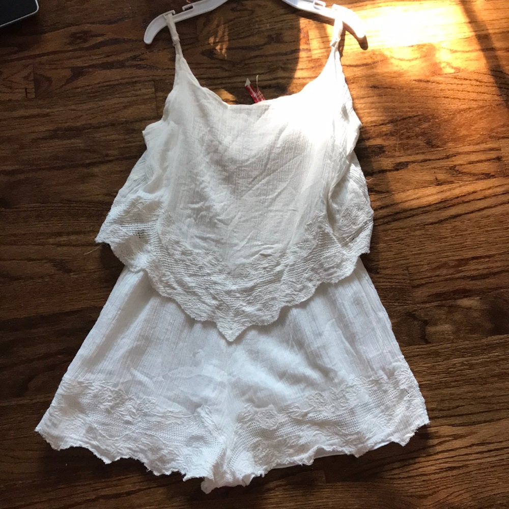 White ruffle romper with cute pattern